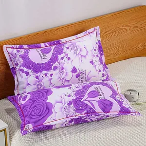 Close-up of a pair of purple floral pillowcases with 'Forever of love' print on a bed.