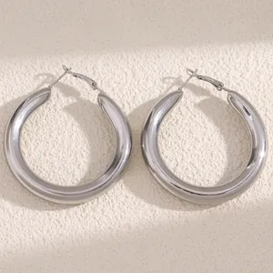 Large silver chunky hoop earrings with a glossy polished finish for women modern fashion