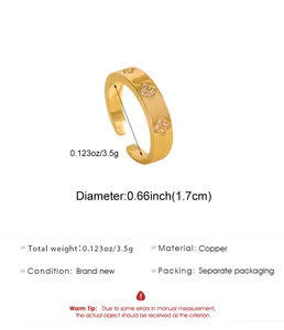 Detailed view of gold copper open ring featuring zircon clover pattern and product dimensions