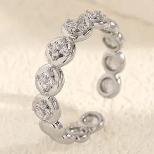 Detailed macro view of silver stainless steel ring featuring elegant flower zircon patterns