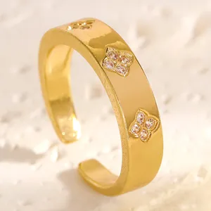 Close-up of gold stainless steel ring with zircon floral patterns