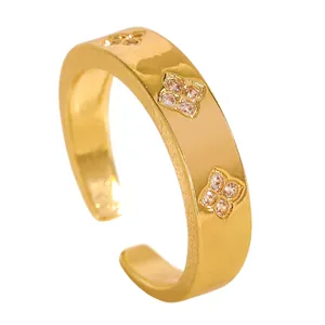 Close-up detail of a gold stainless steel open ring with zircon flower patterns