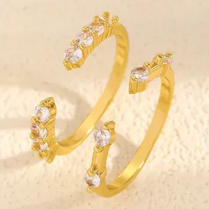 Macro view of gold-plated double-layer open ring with sparkling white zircons