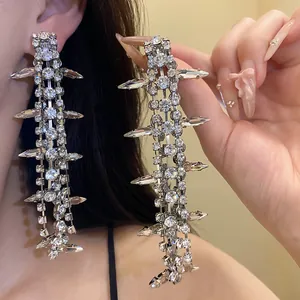 Long tassel chandelier earrings with sparkling clear rhinestones for a glamorous statement