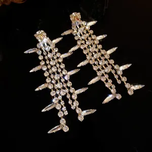 Detail view of rhinestone encrusted fishbone earrings with brilliant crystal sparkle
