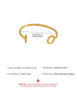 Detailed view of gold stainless steel OT toggle open cuff bracelet with dimensions