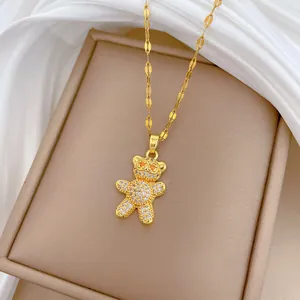 Gold plated stainless steel necklace featuring a micro-set crystal paved teddy bear pendant