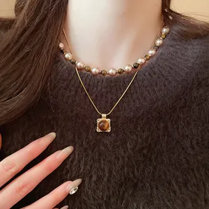 Elegant 18K gold plated pearl necklace with tiger eye pendant in vintage style for women
