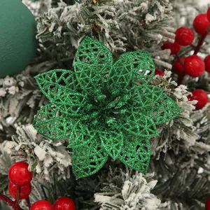Close-up of green glitter hollow poinsettia flower Christmas tree decoration