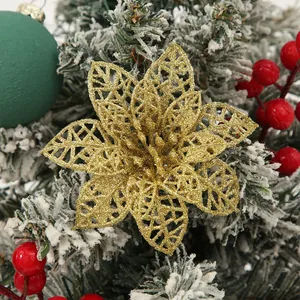 Close-up of a gold glitter hollow poinsettia flower for Christmas tree decoration