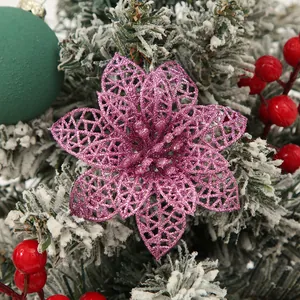 Close-up detail view of pink glitter hollow poinsettia flower for Christmas tree decoration
