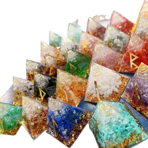 Set of colorful resin crystal pyramids with gold foil and rune symbols
