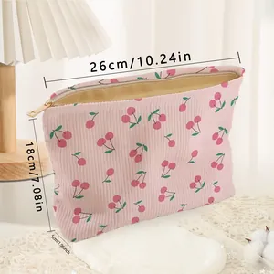 Pink corduroy makeup bag featuring a cute cherry print with 26x18x5cm dimensions