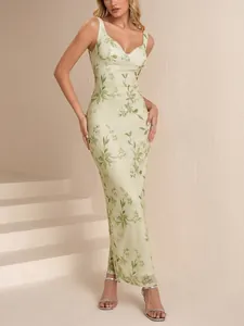 Elegante abito lungo in mesh a bretelles con stampa floreale verde e stile bustier