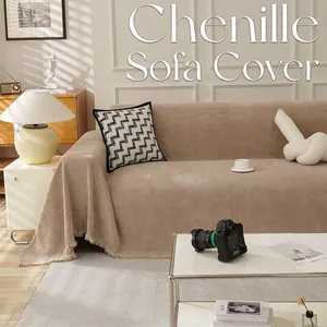 Grande housse de canapé en chenille beige avec motif à chevrons et franges