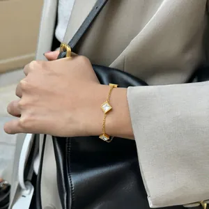 Close-up of a French retro titanium steel bracelet with square diamond charms.