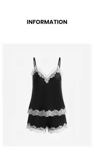 Detailed view of an elegant black satin camisole and shorts set with white lace trim.