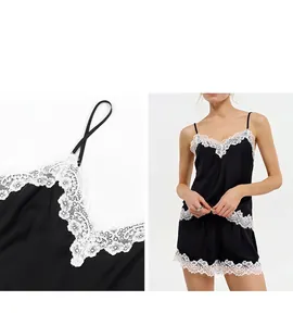 Detail view of French style black lace V-neck camisole and shorts sleepwear set