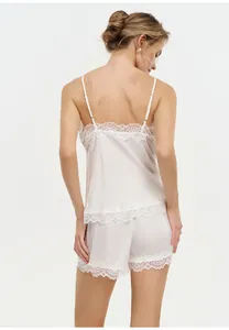 Back view of white satin camisole and shorts set with delicate lace trim for women