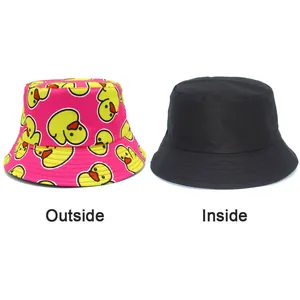 Reversible pink bucket hat featuring cute cartoon duck print and a solid black side