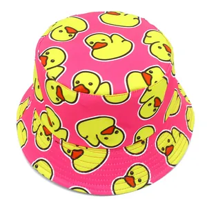Detailed view of a vibrant pink bucket hat featuring an all-over yellow duck pattern.