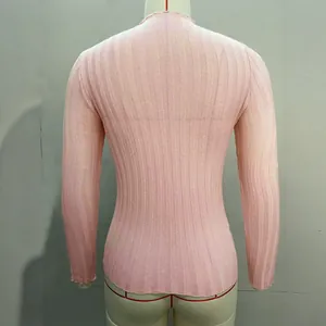 Back view of pink ribbed mock neck long sleeve sweater on a mannequin form