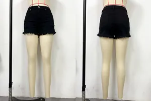 Front and back detail view of black distressed low-waist denim shorts with raw hem