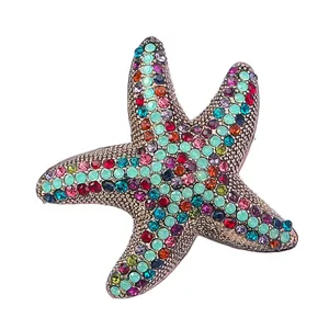 Detail view of a colorful rhinestone starfish brooch for women's fashion accessory.