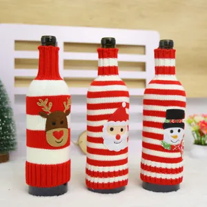 Three festive Christmas knitted wine bottle covers featuring Santa, Reindeer, and Snowman
