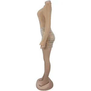 Side view of a sexy champagne gold bodycon jumpsuit with silver rhinestones details
