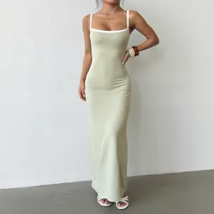 Slim fit sage green knit maxi dress with white contrast straps and backless design
