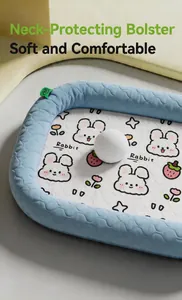 Close-up of cooling ice silk pet mat with cartoon rabbit print and soft blue raised edge.