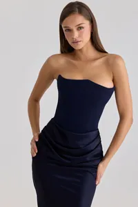 Detailed view of an elegant navy blue strapless satin corset dress with front draping