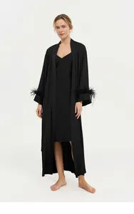 Detailed full-body view of luxury black acetate robe with elegant ostrich feather cuffs