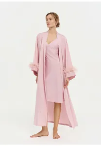 Elegant pink satin loungewear set featuring ostrich feather cuffs and a matching slip dress