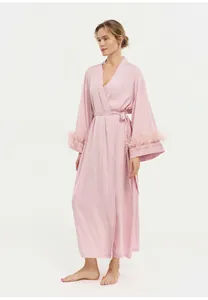 Detailed view of elegant pink acetate robe featuring luxurious ostrich feather cuffs