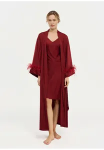 Full-length view of burgundy acetate robe with ostrich feather sleeves and matching slip dress