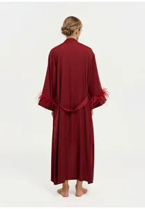 Elegant back view of luxury wine red acetate robe with ostrich feather trim on cuffs