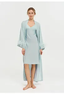 Elegant light blue acetate sleepwear set with luxury ostrich feather cuffs for women.