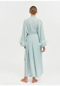 Back view of luxury mint green acetate robe featuring elegant ostrich feather cuffs