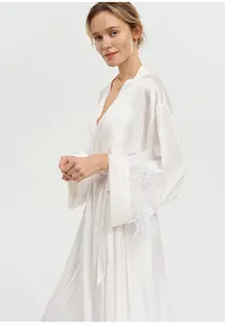 Elegant white acetate satin bathrobe featuring luxurious ostrich feather sleeve trim