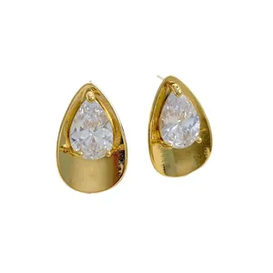 Elegant gold-plated teardrop stud earrings featuring large sparkling cubic zirconia stones.