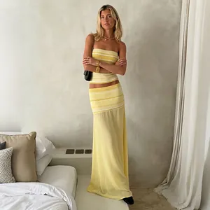 Chic yellow striped bandeau top and mesh semi-sheer maxi skirt two-piece outfit
