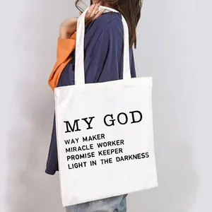 Fashionable white canvas tote bag for women featuring 'MY GOD' printed inspirational text