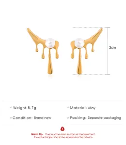 Gold irregular dripping lava earrings with pearl detail and 3cm length.