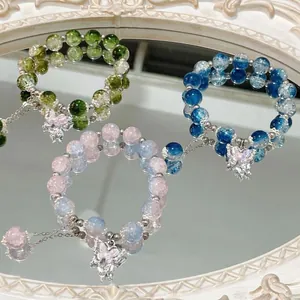 Handmade beaded bracelets with butterfly charms and translucent cracked crystal beads