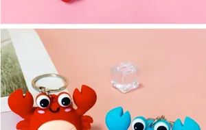Close-up of colorful cartoon crab keychains in red and blue colors for bag charm.