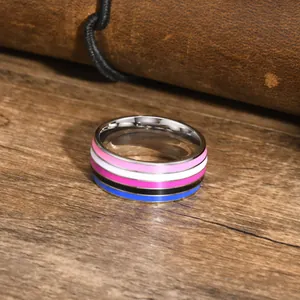 Close-up macro view of genderfluid pride flag striped ring with a polished finish