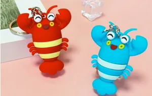 Close-up of cute 3D cartoon lobster and crab keychains in red and blue