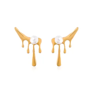Elegant gold-tone melting lava pearl earrings with irregular dripping design.